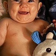 Emory is registered to the contest to win money with this photo: baby, smiling, face, child, plush_toy, cuddling, happiness, cute, indoor, portrait, childhood, young, skin, head, expression, toy, comfort, infant, closeup, person