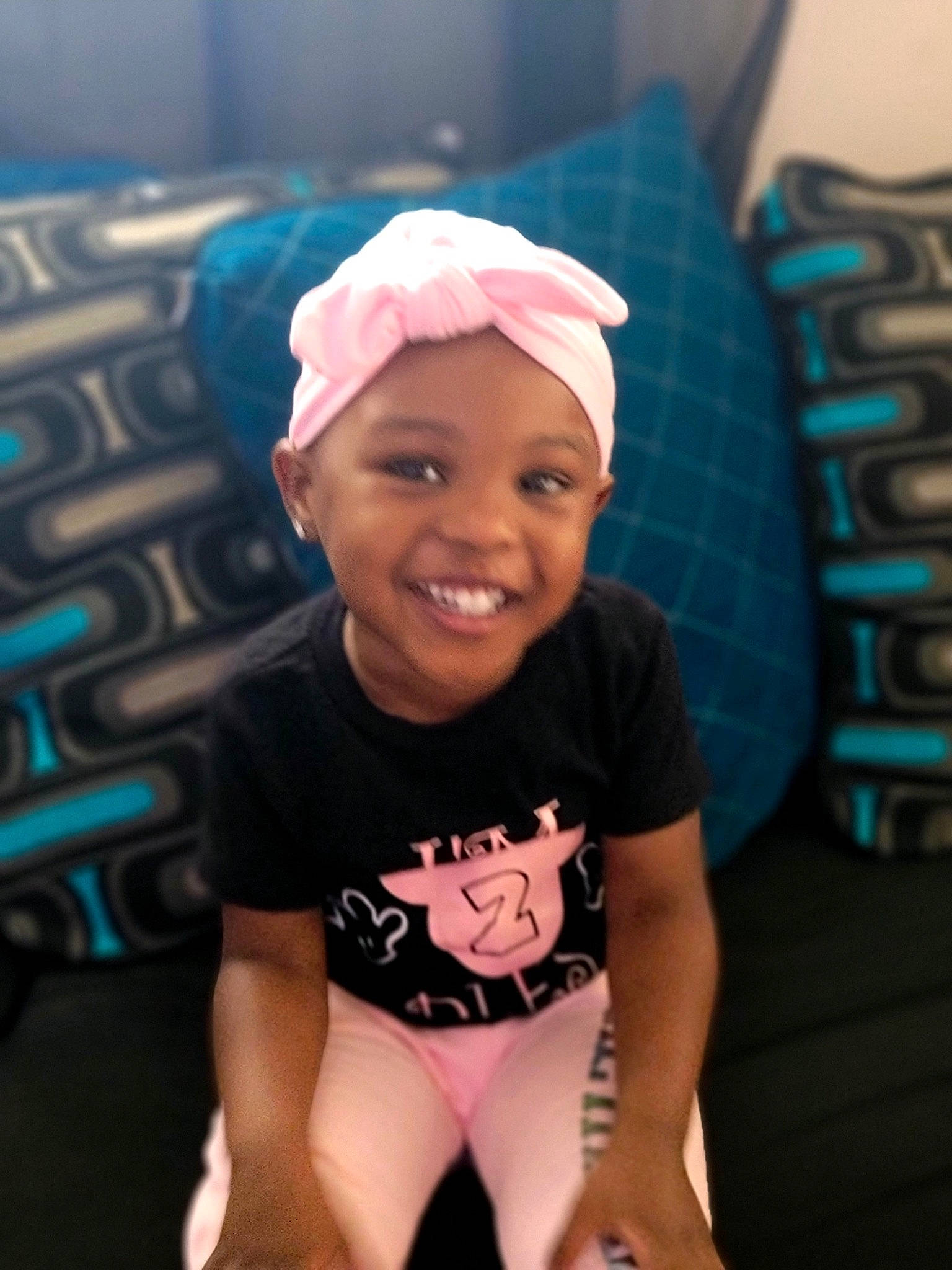 Kiara joined the competition — help win amazing prizes! active_pants, aqua, baby_toddler_clothing, bonnet, cap, child, comfort, eye, happy, headgear, headwear, joy, laugh, long_sleeved_t_shirt, nose, person, sleeve, smile, teal, thigh