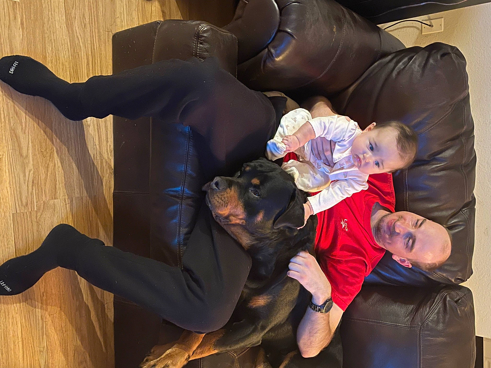 Bailey is registered to the contest to win money with this photo: arm, boot, child, comfort, entertainment, event, formal_wear, fun, gesture, happy, jacket, joy, performing_arts, person, shoe, sitting, smile, sneakers, suit, toddler