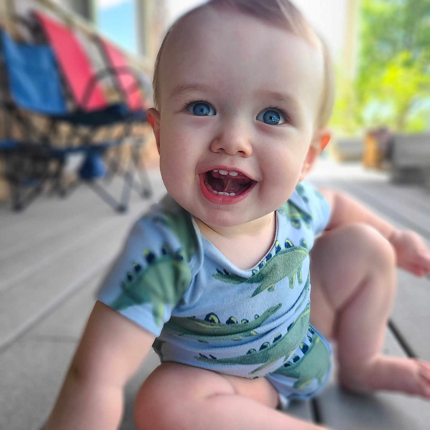 Kaedon joined the competition — help win amazing prizes! baby, babylaughing, city, clothing, face, happy, head, laughing, person, photography, plant, portrait, pottedplant, road, sitting, smile, street, summer, t_shirt, urban