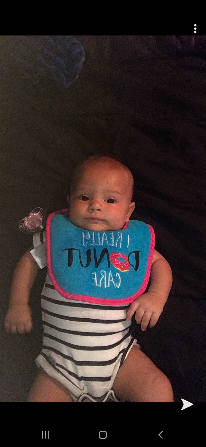 Brenley is registered to the contest to win money with this photo: arm, baby, baby_products, baby_toddler_clothing, cheek, child, head, neck, person, product, skin, smile, t_shirt, toddler