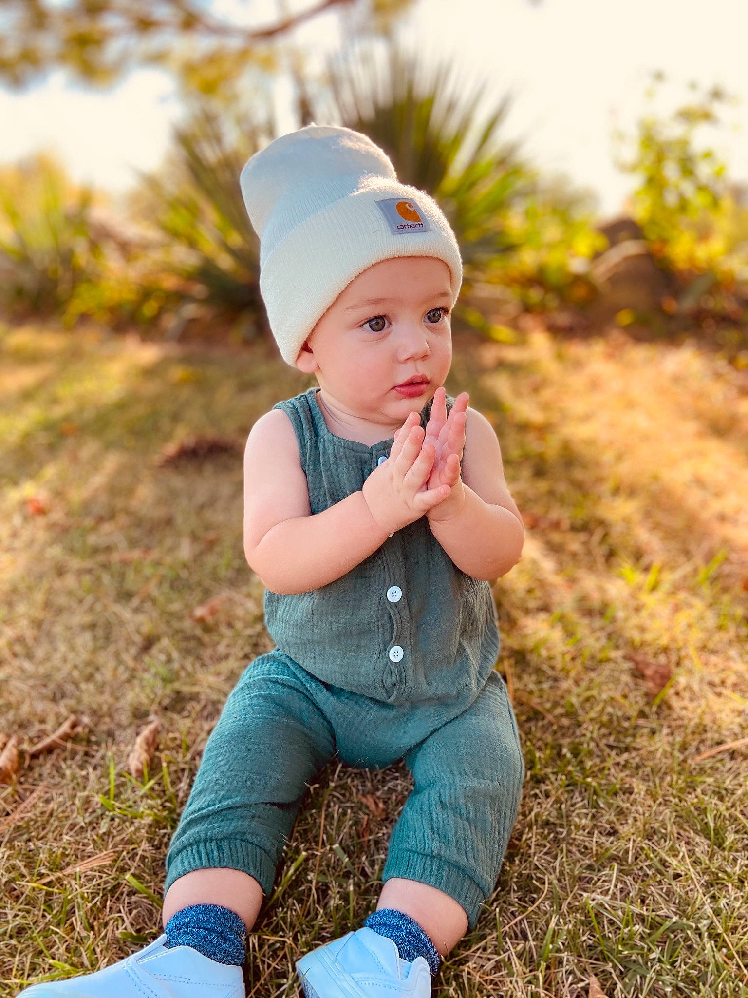 Zayden is registered to the contest to win money with this photo: baby, baby_toddler_clothing, cap, child, electric_blue, flash_photography, grass, grassland, happy, hat, head, headwear, leaf, people_in_nature, person, plant, sky, sleeve, sunlight, t_shirt