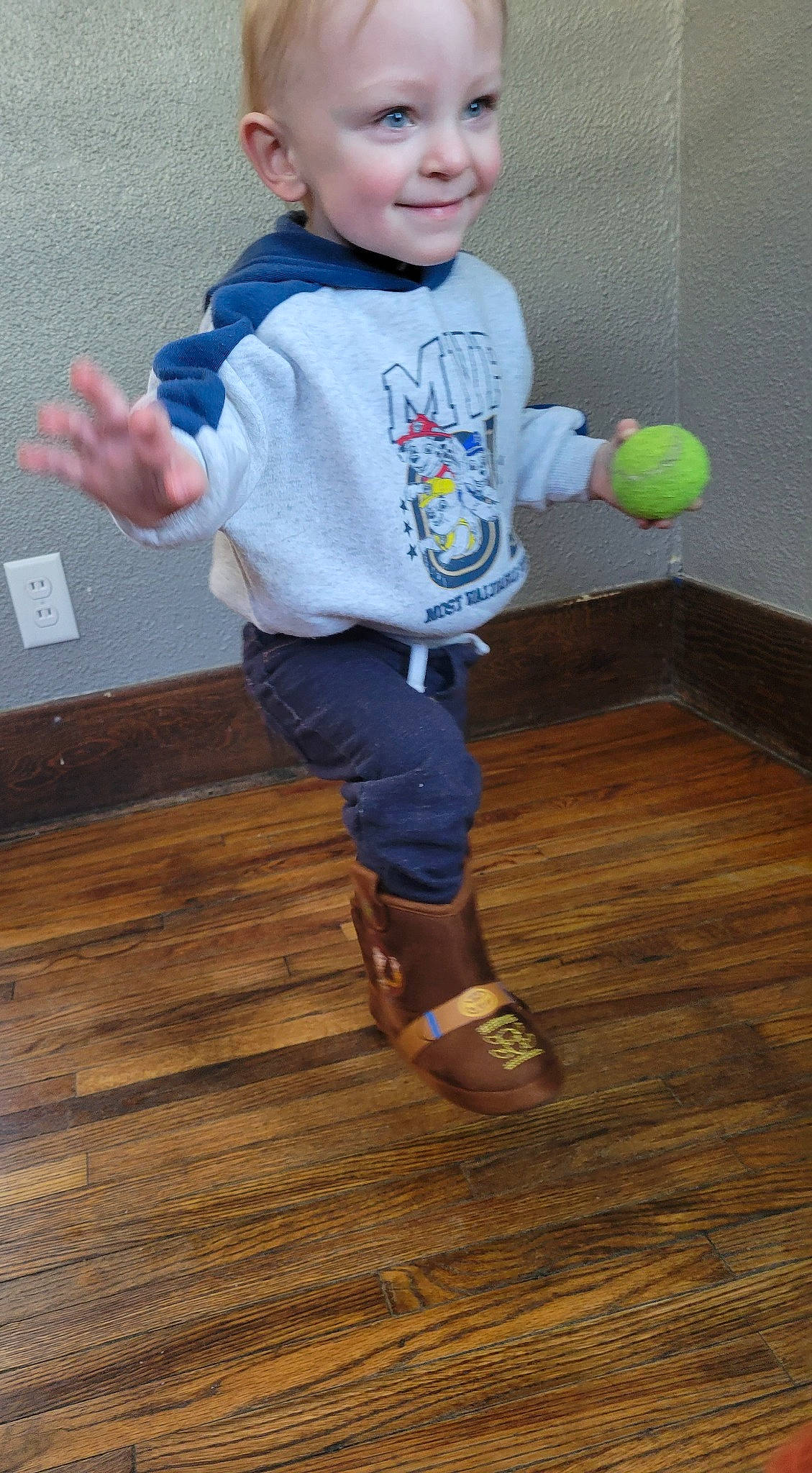 Kai joined the competition — help win amazing prizes! arm, baby_toddler_clothing, child, electric_blue, floor, flooring, fun, happy, hardwood, head, joint, joy, person, sleeve, smile, sportswear, standing, t_shirt, toddler, toy