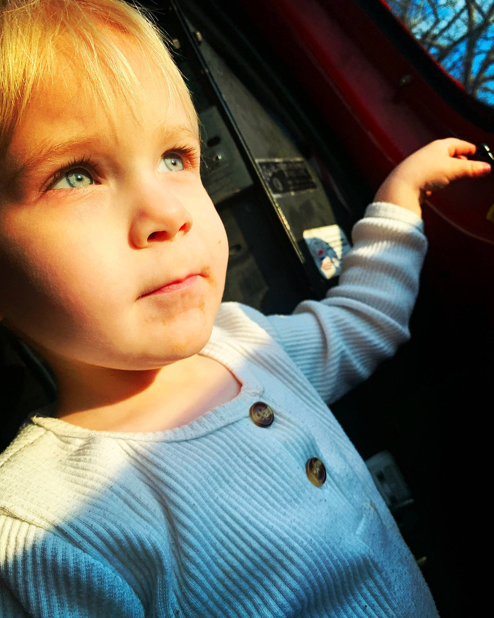 Dallas is registered to the contest to win money with this photo: auto_part, automotive_exterior, automotive_lighting, automotive_mirror, child, cool, eyelash, flash_photography, fun, gesture, lip, motor_vehicle, nose, person, rear_view_mirror, steering_wheel, tints_and_shades, toddler, vehicle_door, window