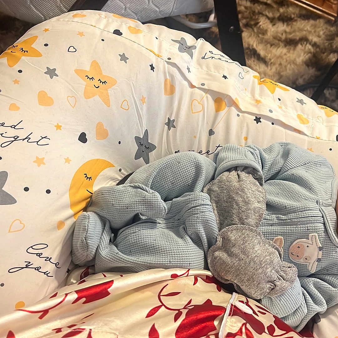 Mohamed is registered to the contest to win money with this photo: baby, bed, bedroom, blanket, clothing, couch, crib, cushion, face, furniture, glove, head, homedecor, indoors, newborn, person, plate, quilt, room, sleeping