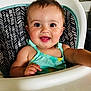 baby, child, high_chair, smiling, happy, face, person, clothing, sitting, indoor, cute, portrait, young_child, infant, dressed, seat, furniture, skin, head, arm