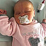 baby, sleeping, pacifier, pink_clothing, infant, cute, mouse_patch, pocket, soft_fabric, hand, face, closed_eyes, indoors, child, newborn, resting, peaceful, toddler, cute_baby, portrait