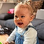 Haïvie participe au concours pour gagner de l'argent avec cette photo : baby, infant, toddler, smile, laughing, denim_overalls, white_shirt, bow, hair, eyes, teeth, wooden_table, hand, couch, living_room, indoor, portrait, close_up, shallow_depth_of_field, happy