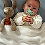 Haïvie participe au concours pour gagner de l'argent avec cette photo : baby, pacifier, blanket, plush_toy, bunny, soft_toy, infant, child, sleepwear, bedtime, comfort, cuddly, cute, portrait, indoors, resting, warm, cozy, hands, face