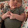 Oakley joined the competition — help win amazing prizes! animal_print, baby, child, cute, floral_pattern, hands, human, indoors, infant, newborn, onesie, peaceful, pillow, portrait, resting, skin, sleeping, soft_light, striped_clothing, toddler
