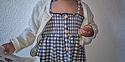 Nellya participe au concours pour gagner de l'argent avec cette photo : toddler, child, smiling, dress, cardigan, paper, happy, indoors, person, wall, floor, button, clothing, portrait, standing, cute, young, expression, holding, fashion
