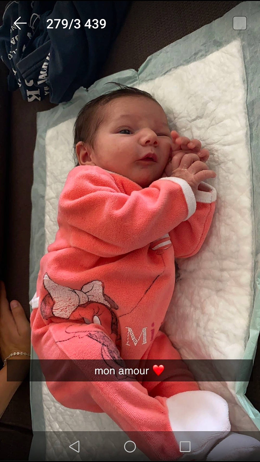 Livia a rejoint le concours — aidez-le/la à gagner de superbes lots ! baby, baby_products, baby_toddler_clothing, carmine, cheek, child, comfort, event, face, happy, head, linens, lip, magenta, mouth, person, pink, sitting, skin, sleeve