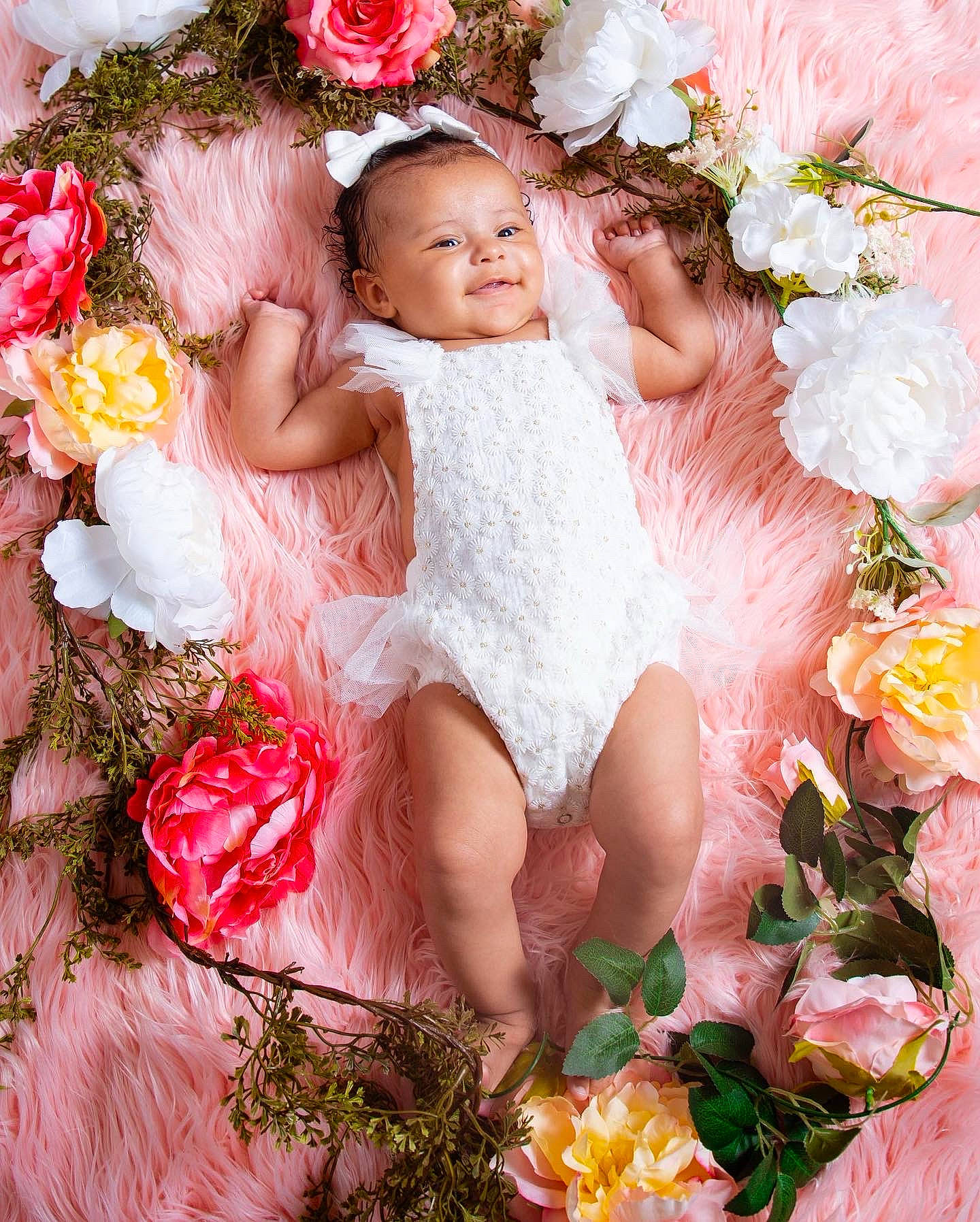 Evee is registered to the contest to win money with this photo: baby, baby_toddler_clothing, botany, bouquet, dress, embellishment, flash_photography, flower, flower_arranging, grass, happy, people_in_nature, person, petal, pink, plant, rose, skin, textile, white