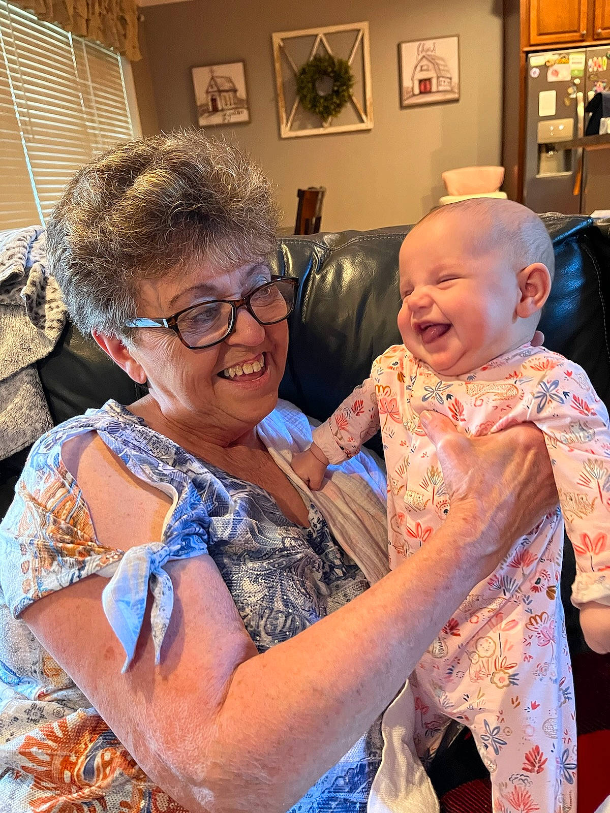 Rachel is registered to the contest to win money with this photo: baby_toddler_clothing, child, couch, event, eyewear, fashion_design, fun, glasses, hairstyle, happy, head, iris, joy, necklace, person, picture_frame, shoulder, skin, smile, t_shirt