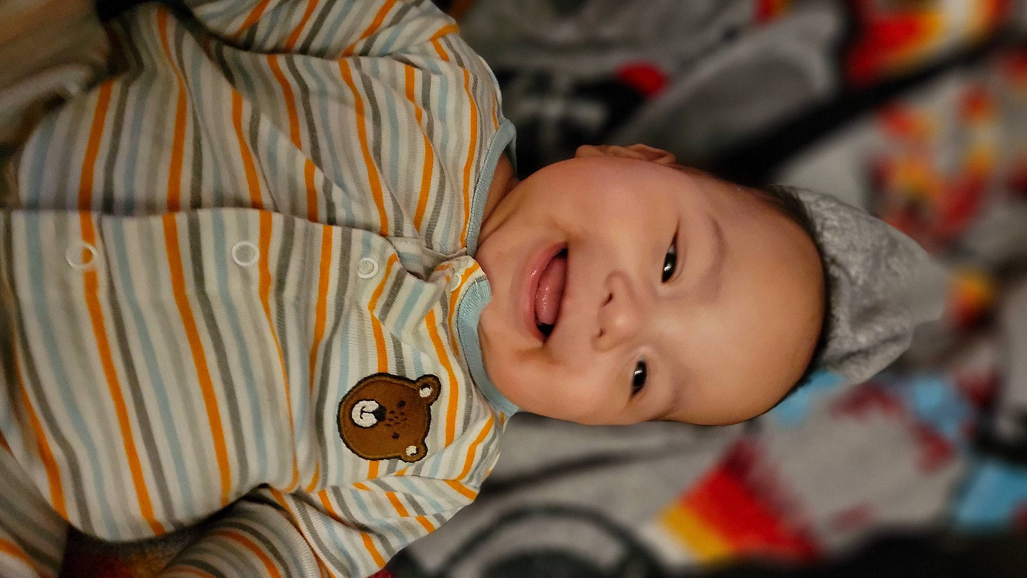 Takoda is registered to the contest to win money with this photo: baby, baby_products, baby_toddler_clothing, cheek, child, chin, eye, eyelash, facial_expression, fun, happy, iris, joy, lip, nose, orange, person, skin, sleeve, smile