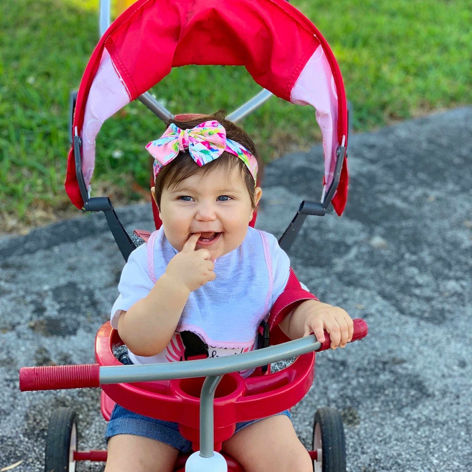 Melody joined the competition — help win amazing prizes! baby_products, child, fun, happy, headwear, joy, person, plant, play, product, red, smile, summer, toddler, tricycle, vacation, vehicle
