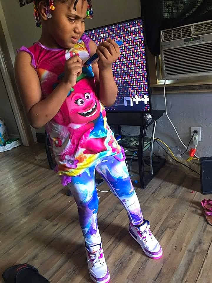 Mercy is registered to the contest to win money with this photo: child, headwear, pajamas, performance, person, pink, shoe, singing, talent_show, toddler