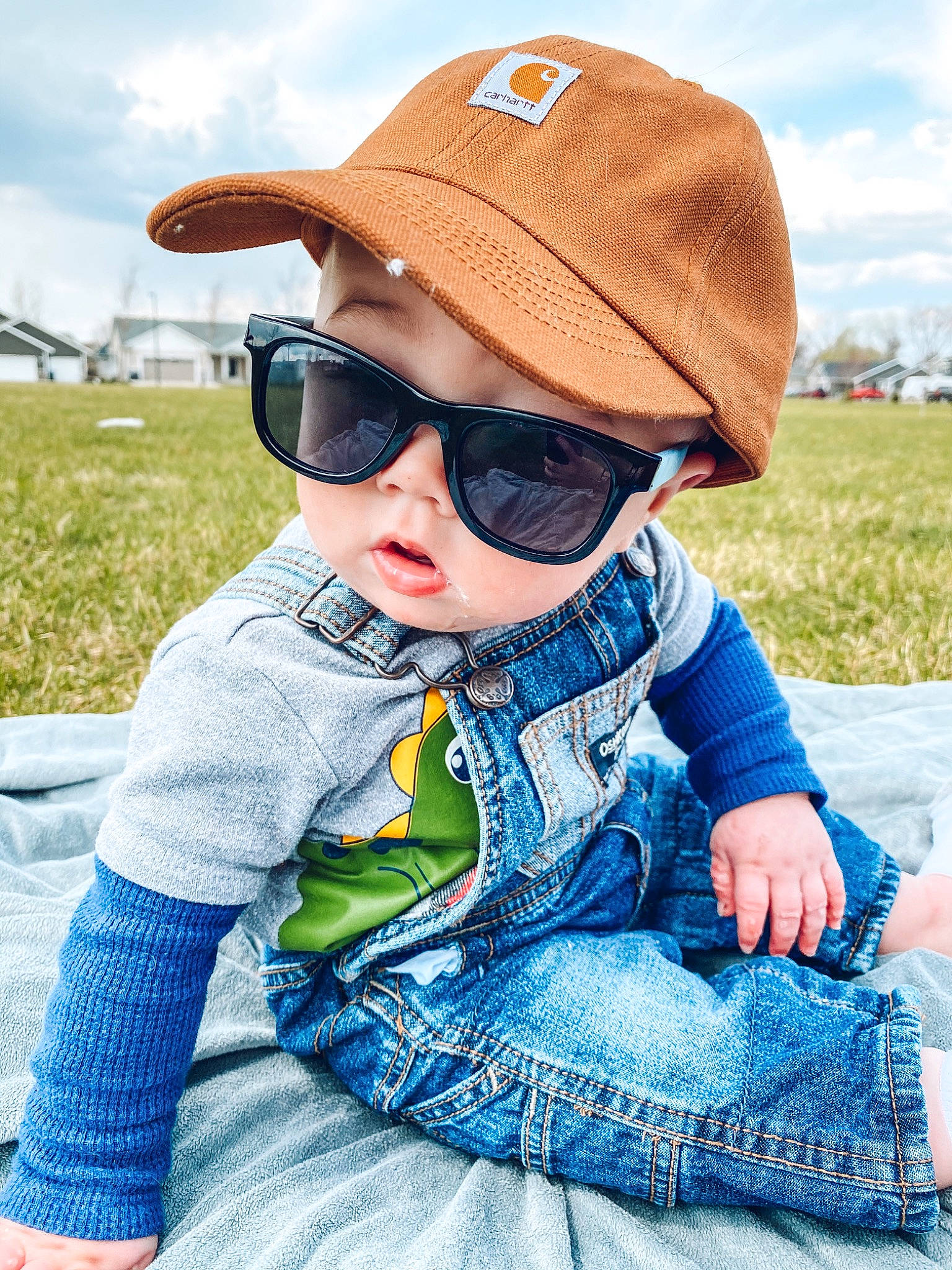 Oakland joined the competition — help win amazing prizes! baby, child, clothing, cool, denim, eyewear, fashion_accessory, glasses, grass, hat, headgear, headwear, jeans, outerwear, person, photography, smile, summer, sun_hat, sunglasses