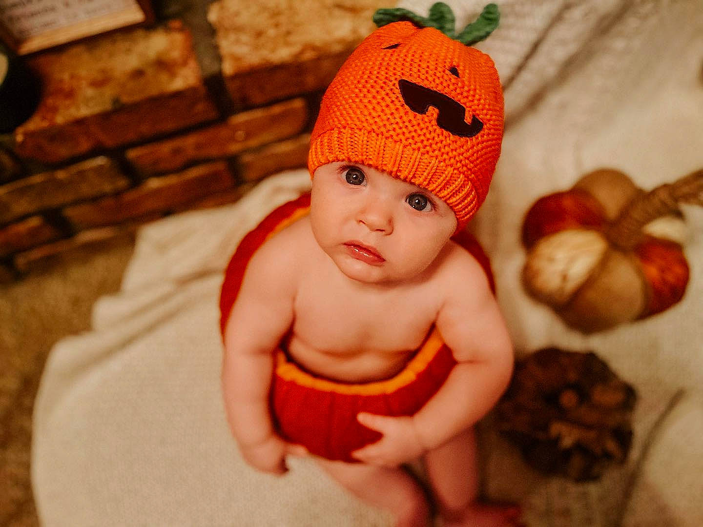 Hugh is registered to the contest to win money with this photo: abdomen, baby, baby_sleeping, baby_toddler_clothing, cap, cheek, child, comfort, happy, headgear, headwear, orange, person, room, skin, stomach, textile, thumb, toddler, trunk