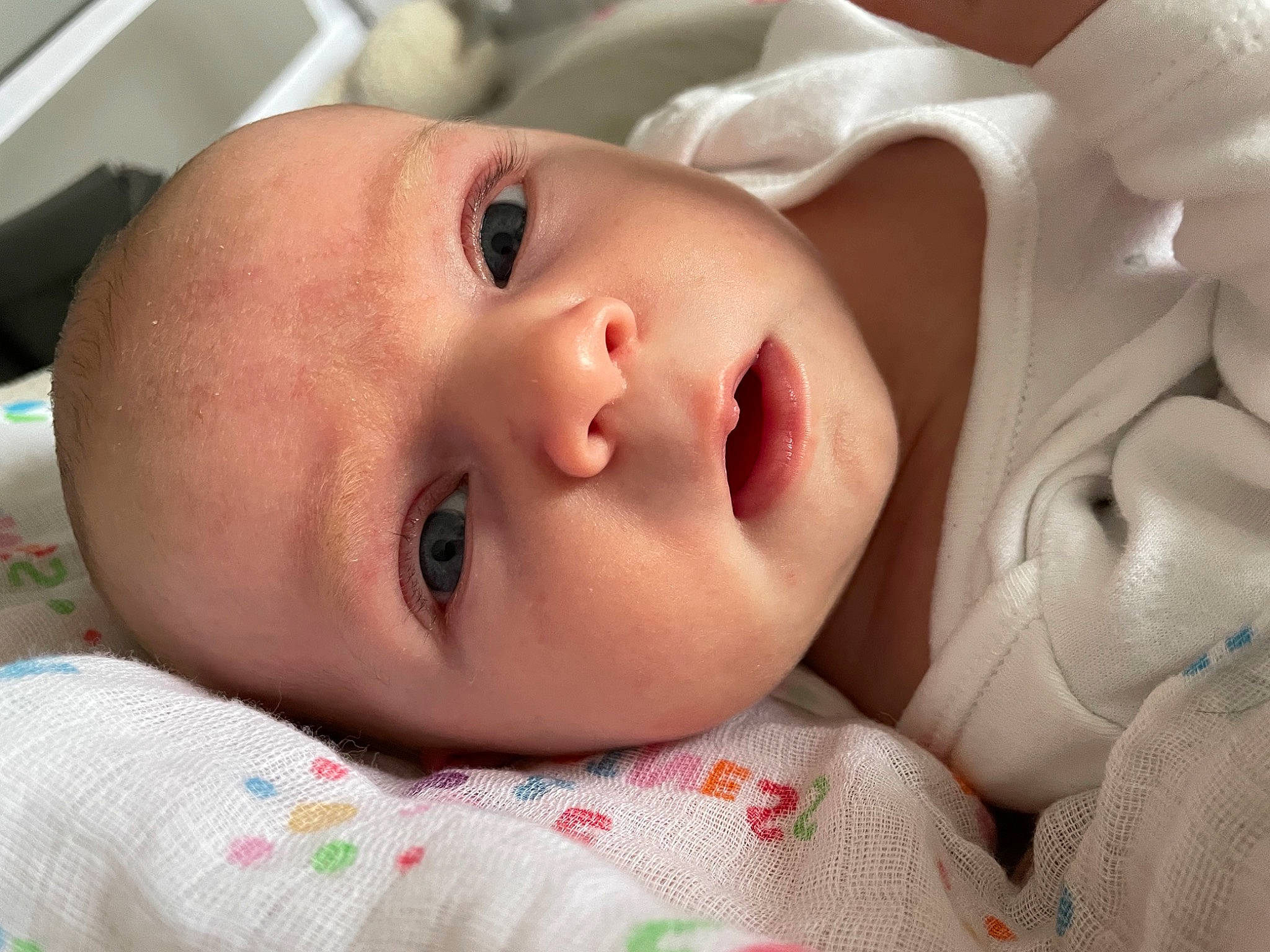 Ellie is registered to the contest to win money with this photo: baby, baby_toddler_clothing, cheek, chin, comfort, eye, eyebrow, eyelash, human, iris, lip, mammal, mouth, nose, people, person, product, skin, textile, toddler