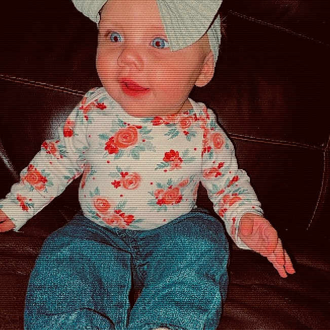 Adilyn joined the competition — help win amazing prizes! baby, bonnet, cap, clothing, couch, cushion, face, footwear, furniture, glove, hat, head, homedecor, jeans, pants, person, photography, portrait, shoe, sitting