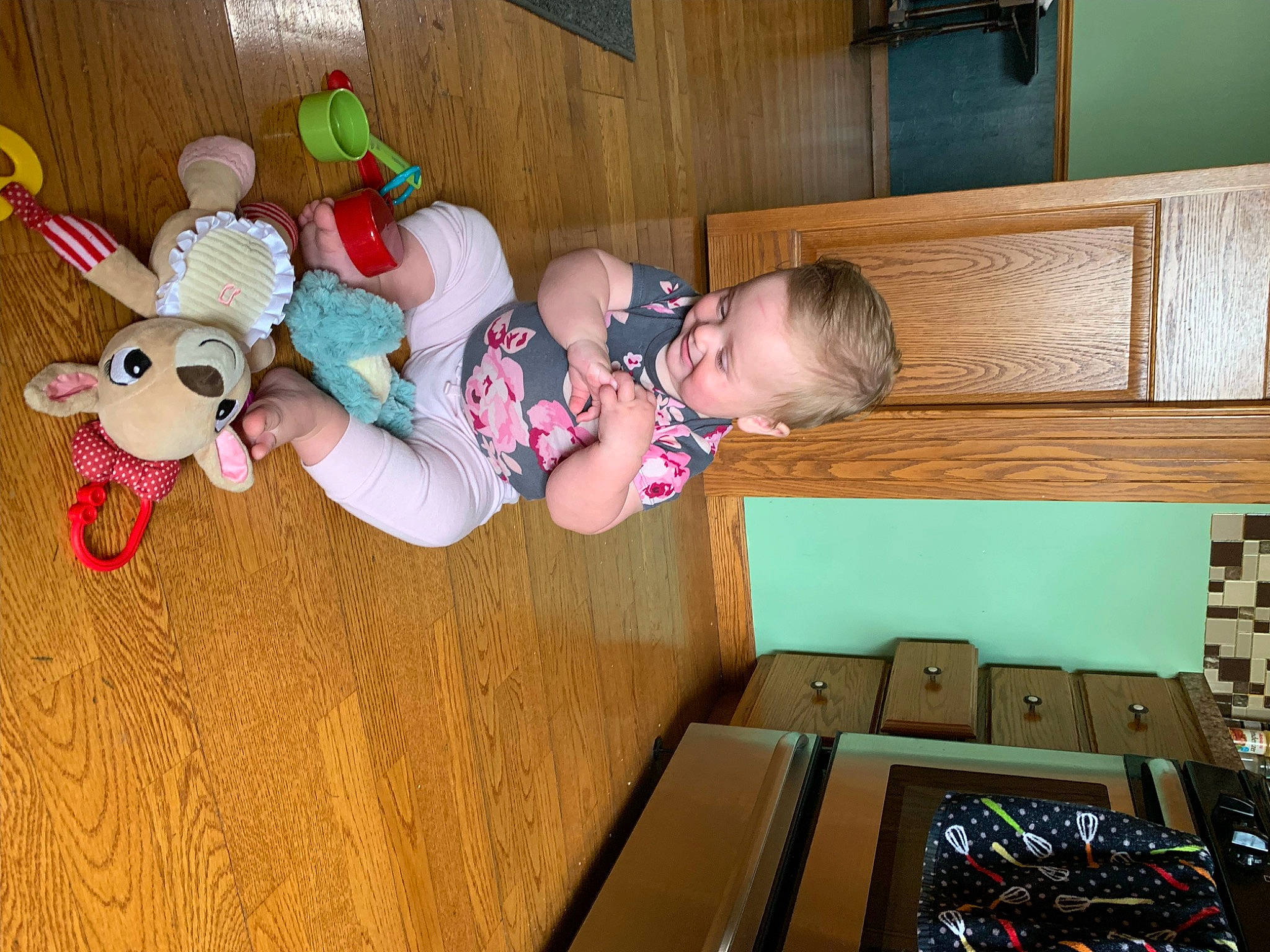 Paislee joined the competition — help win amazing prizes! baby, baby_products, baby_toddler_clothing, baby_toys, box, cardboard, carton, child, comfort, flooring, fun, hardwood, person, play, room, shipping_box, sitting, sock, toddler, toy