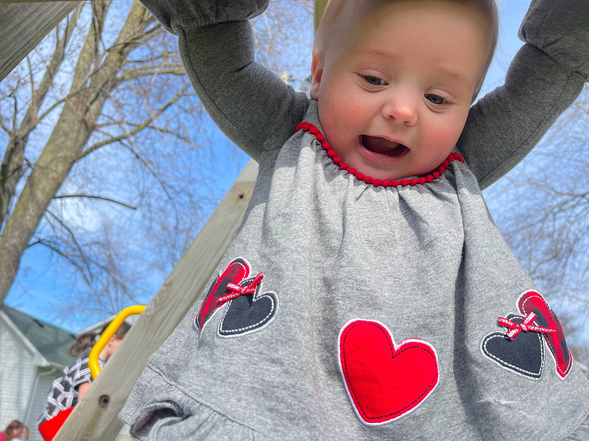 Paislee is registered to the contest to win money with this photo: baby, baby_toddler_clothing, carmine, cheek, child, facial_expression, fun, gesture, grass, hairstyle, happy, mammal, person, photograph, pink, red, sky, sleeve, t_shirt, toddler
