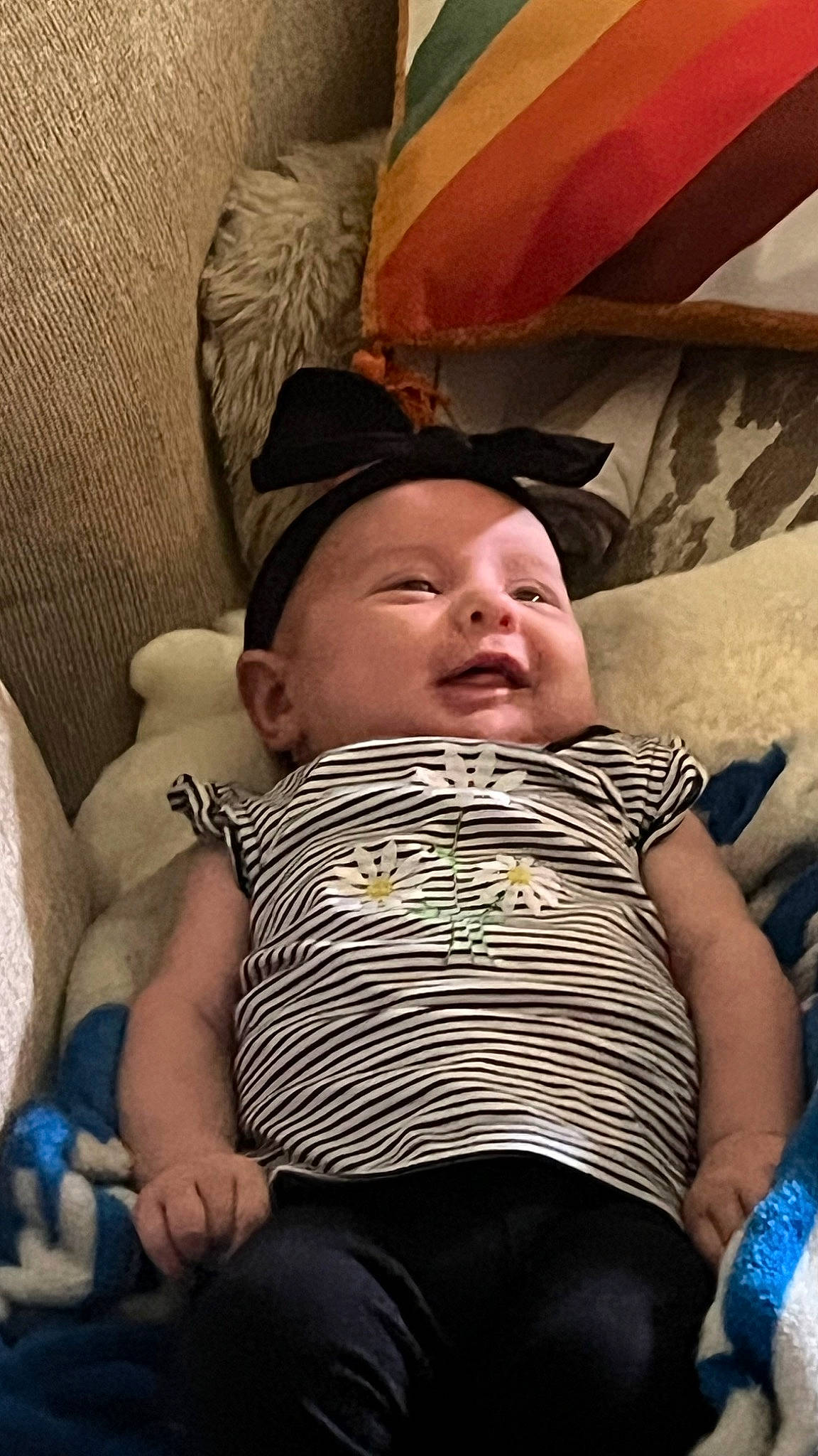 Adelynn joined the competition — help win amazing prizes! baby, baby_products, baby_toddler_clothing, blue, cheek, child, comfort, eye, face, fun, happy, head, lap, linens, mouth, person, sitting, skin, smile, thigh