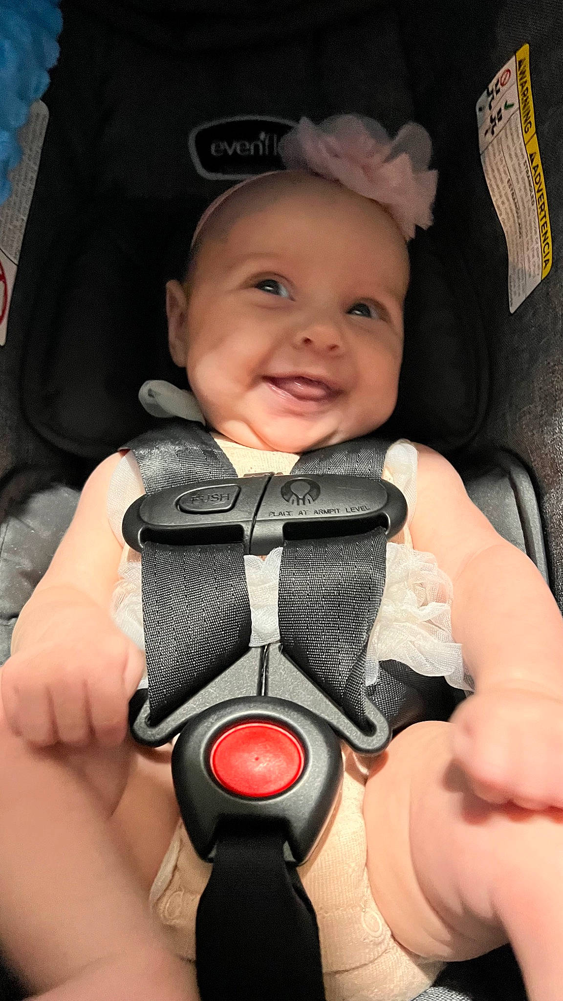 Adelynn is registered to the contest to win money with this photo: baby, baby_carriage, baby_in_car_seat, cheek, comfort, eye, eyebrow, face, finger, gesture, hand, head, headwear, joy, mouth, people, person, product, seat_belt, skin