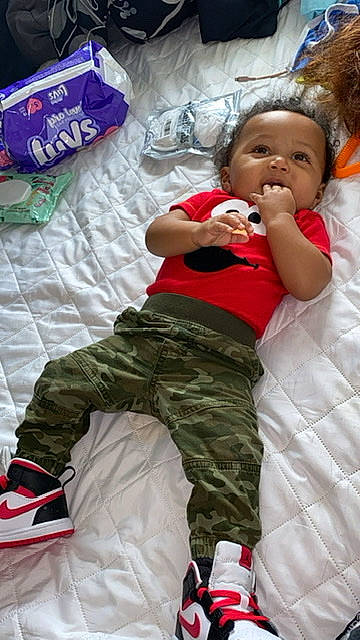 Emmitt Jr joined the competition — help win amazing prizes! arm, baby, baby_toddler_clothing, child, comfort, event, face, fun, gesture, hairstyle, happy, head, knee, person, photograph, red, sitting, textile, thigh, toddler