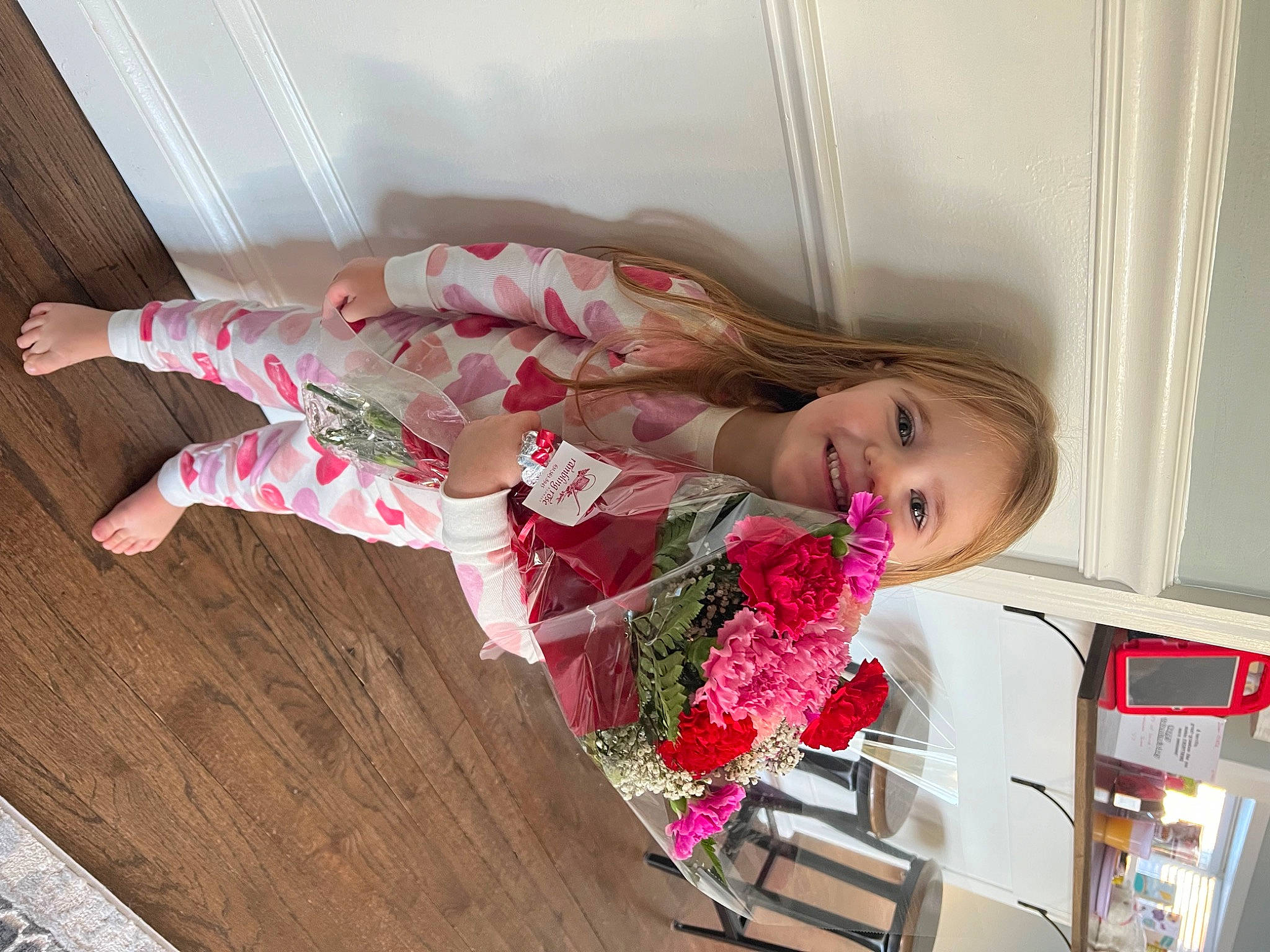Ellie joined the competition — help win amazing prizes! child, comfort, dress, fashion_design, flooring, flower, fun, hardwood, human_leg, joy, magenta, pattern, person, pink, plant, room, smile, sock, thigh, toddler