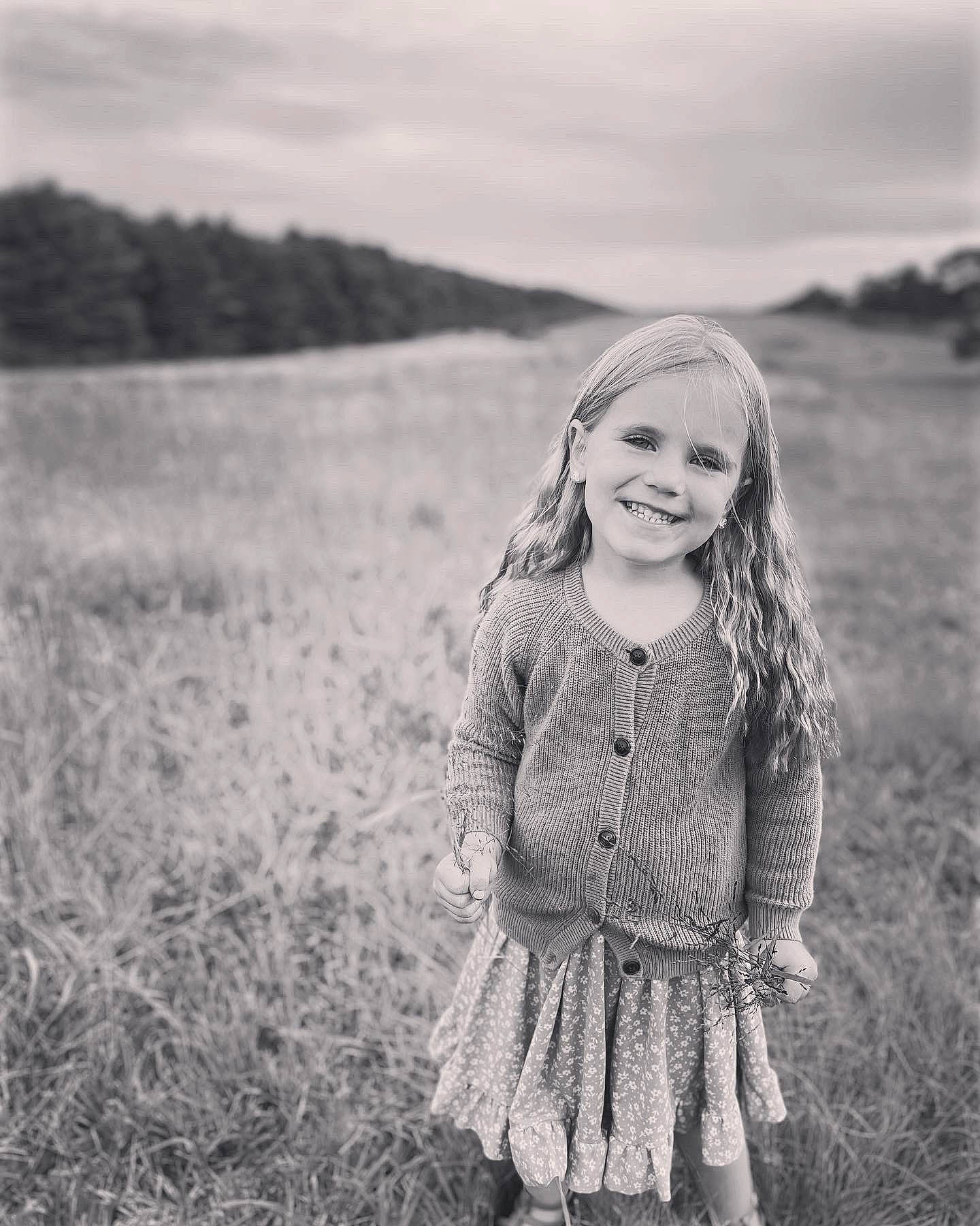 Ellie joined the competition — help win amazing prizes! black, black_and_white, cloud, eye, face, flash_photography, grass, hairstyle, happy, head, iris, joy, outerwear, people_in_nature, person, plant, skin, sky, smile, style