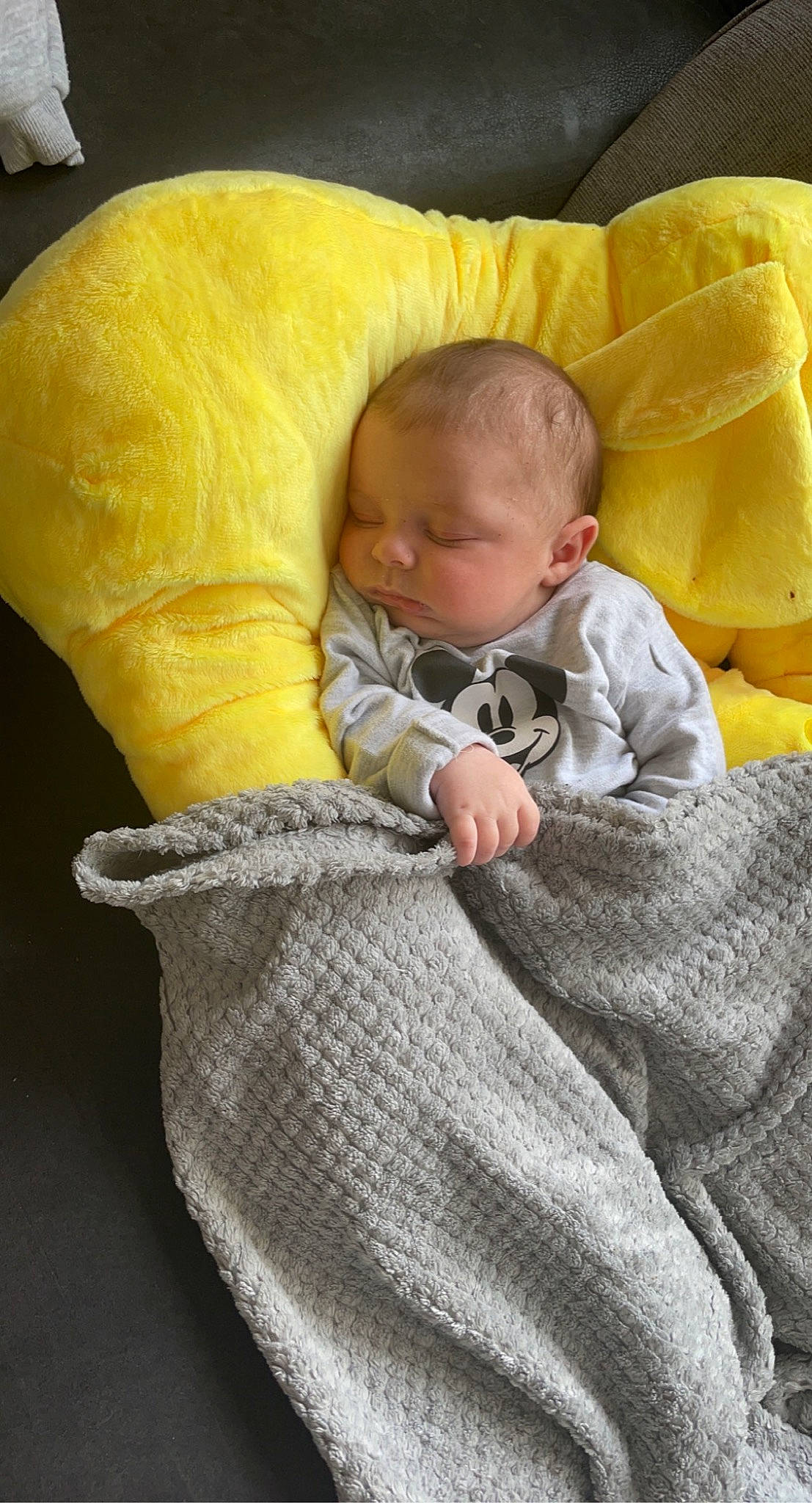 Kelvin is registered to the contest to win money with this photo: baby, baby_products, baby_sleeping, baby_toddler_clothing, bedding, bedtime, cheek, child, comfort, eye, flooring, human_body, linens, person, product, sitting, skin, sleeve, textile, toddler