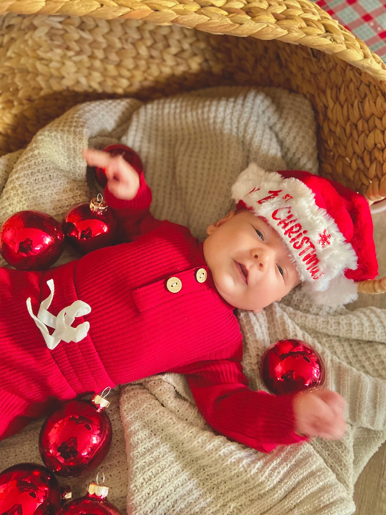 Rowan is registered to the contest to win money with this photo: baby, baby_sleeping, baby_toddler_clothing, child, comfort, eye, head, headgear, headwear, linens, mammal, pattern, person, red, skin, sleeve, smile, textile, toddler, vertebrate