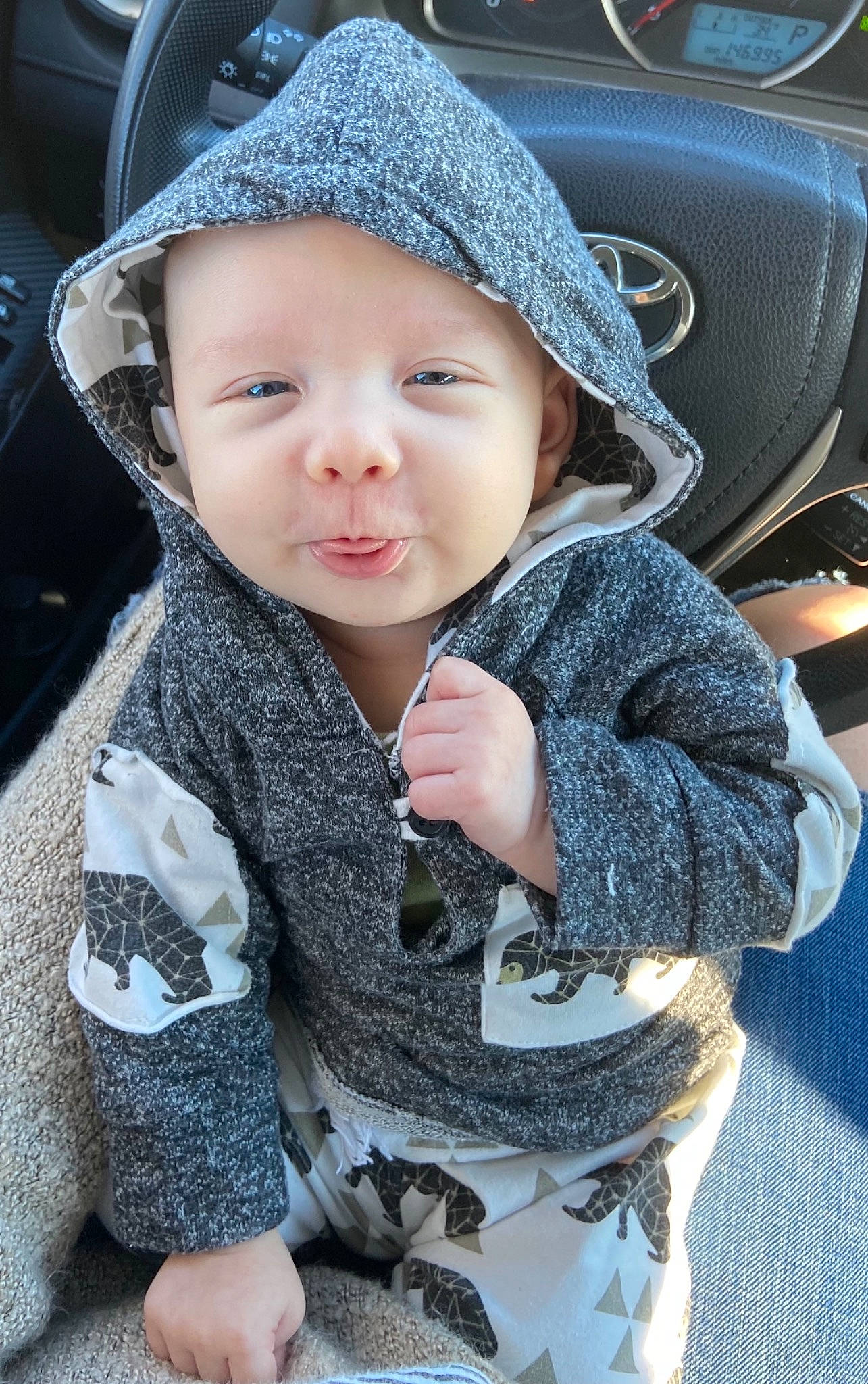 Rowan joined the competition — help win amazing prizes! auto_part, baby, baby_toddler_clothing, cap, car_seat, child, cool, electric_blue, hat, headgear, headwear, lip, motor_vehicle, outerwear, person, skin, sleeve, smile, steering_wheel, toddler