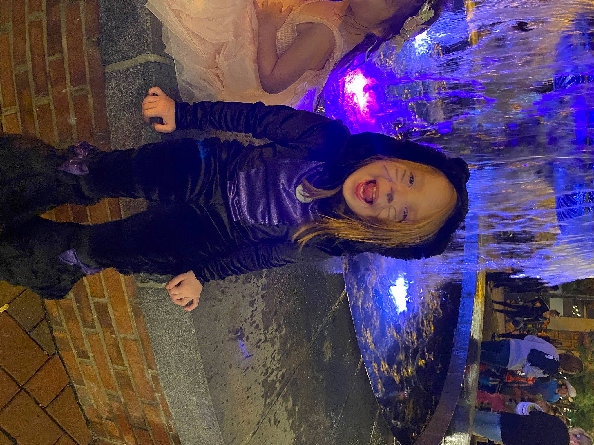 Piper is registered to the contest to win money with this photo: electric_blue, electricity, event, fun, leisure, night, person, plant, purple, reflection, sky, tree, winter