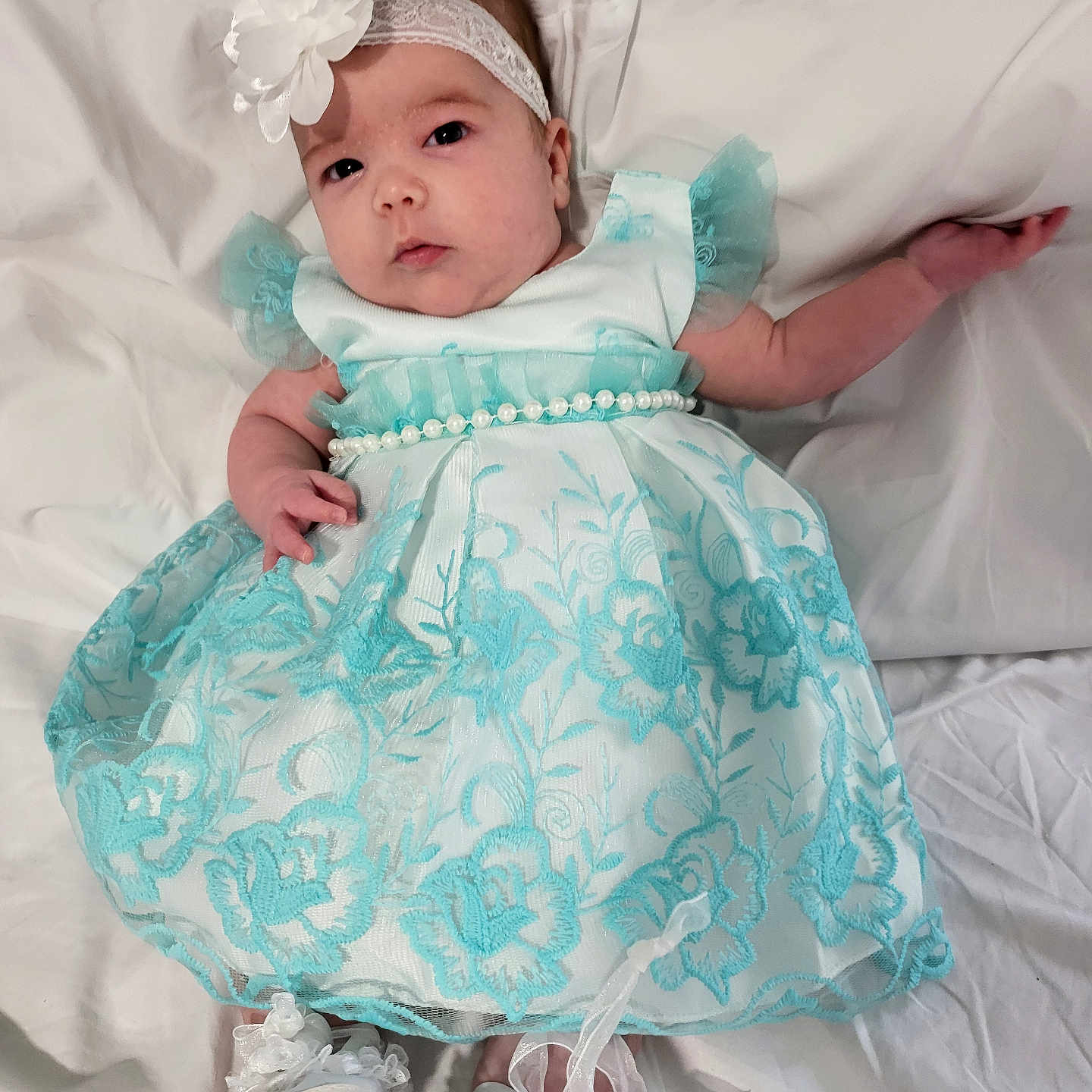 Valerie joined the competition — help win amazing prizes! baby, bed, bodypart, bonnet, cap, clothing, costume, dress, face, footwear, formalwear, furniture, hat, head, newborn, person, photography, portrait, shoe, sitting