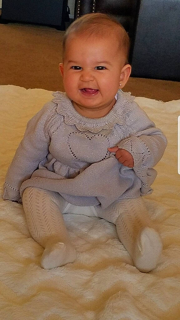 Lluvia joined the competition — help win amazing prizes! baby, cheek, child, face, head, nose, person, sitting, skin, smile, toddler