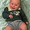 baby, smiling, infant, child, clothing, sweater, shorts, barefoot, blanket, soft_texture, portrait, happy, cute, young, lying_down, skin, face, head, legs, indoors