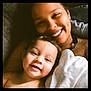 Jeremiah is registered to the contest to win money with this photo: adult, toddler, smile, face, blanket, indoor, happy, family, portrait, cozy, cuddle, child, person, closeup, warmth, skin, head, love, together, relax