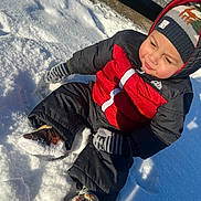 Jeremiah joined the competition — help win amazing prizes! child, toddler, snow, winter_clothing, mittens, beanie, outdoor, snow_boots, red_jacket, black_pants, sunlight, playful, cold_weather, happy, seasonal, frost, snowy_ground, cute, warm_clothing, fun