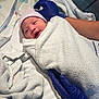 newborn, baby, hospital, towel, wrapped, gloved_hands, medical, infant, hat, person, bed, blanket, healthcare, cute, face, skin, lying_down, care, patient, fresh