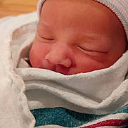 Monoah joined the competition — help win amazing prizes! newborn, baby, infant, swaddled, hospital_blanket, knit_hat, sleeping, closed_eyes, face, nose, eyelashes, rosy_cheeks, cozy, closeup, portrait, soft_texture, skin, peaceful, bedding, person