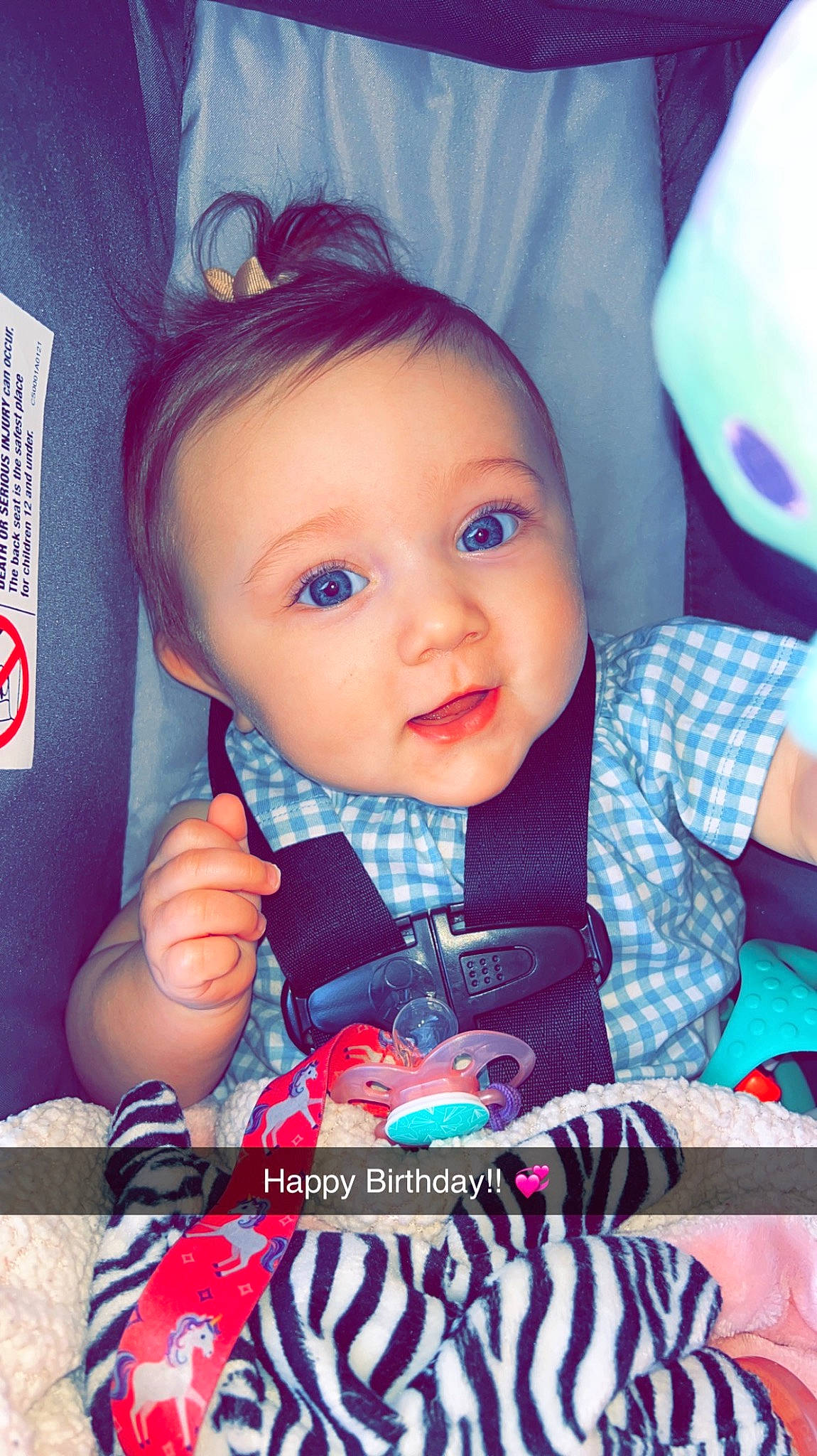 Alianna is registered to the contest to win money with this photo: baby, baby_products, baby_toddler_clothing, cheek, child, cool, electric_blue, eyelash, facial_expression, fashion_accessory, hairstyle, happy, iris, person, pink, product, sitting, skin, sleeve, smile