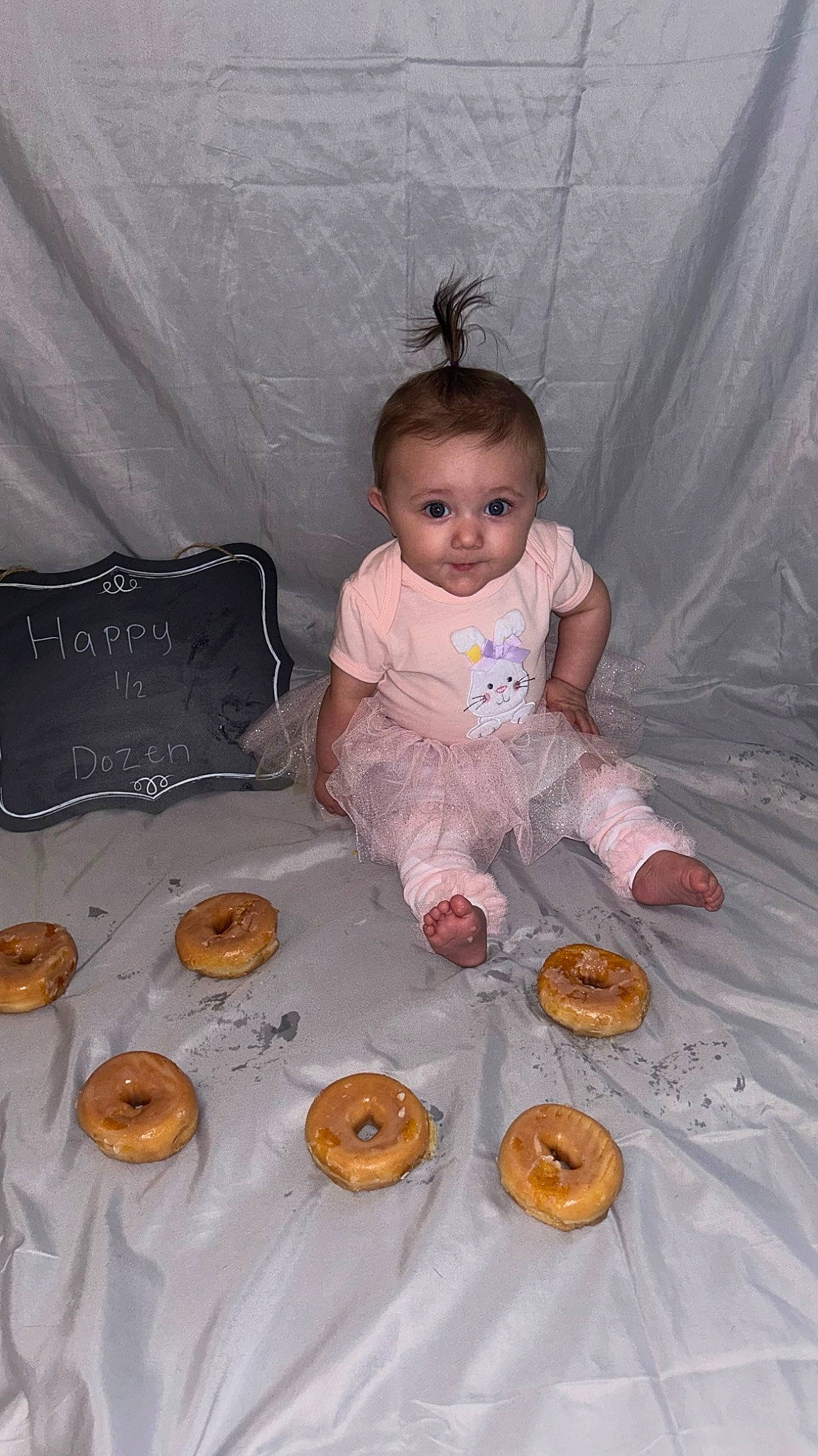 Alianna is registered to the contest to win money with this photo: baby, baking, calabaza, child, comfort_food, cuisine, dessert, event, finger_food, food, gourd, happy, person, plate, pumpkin, sitting, sweetness, tableware, teddy_bear, toddler