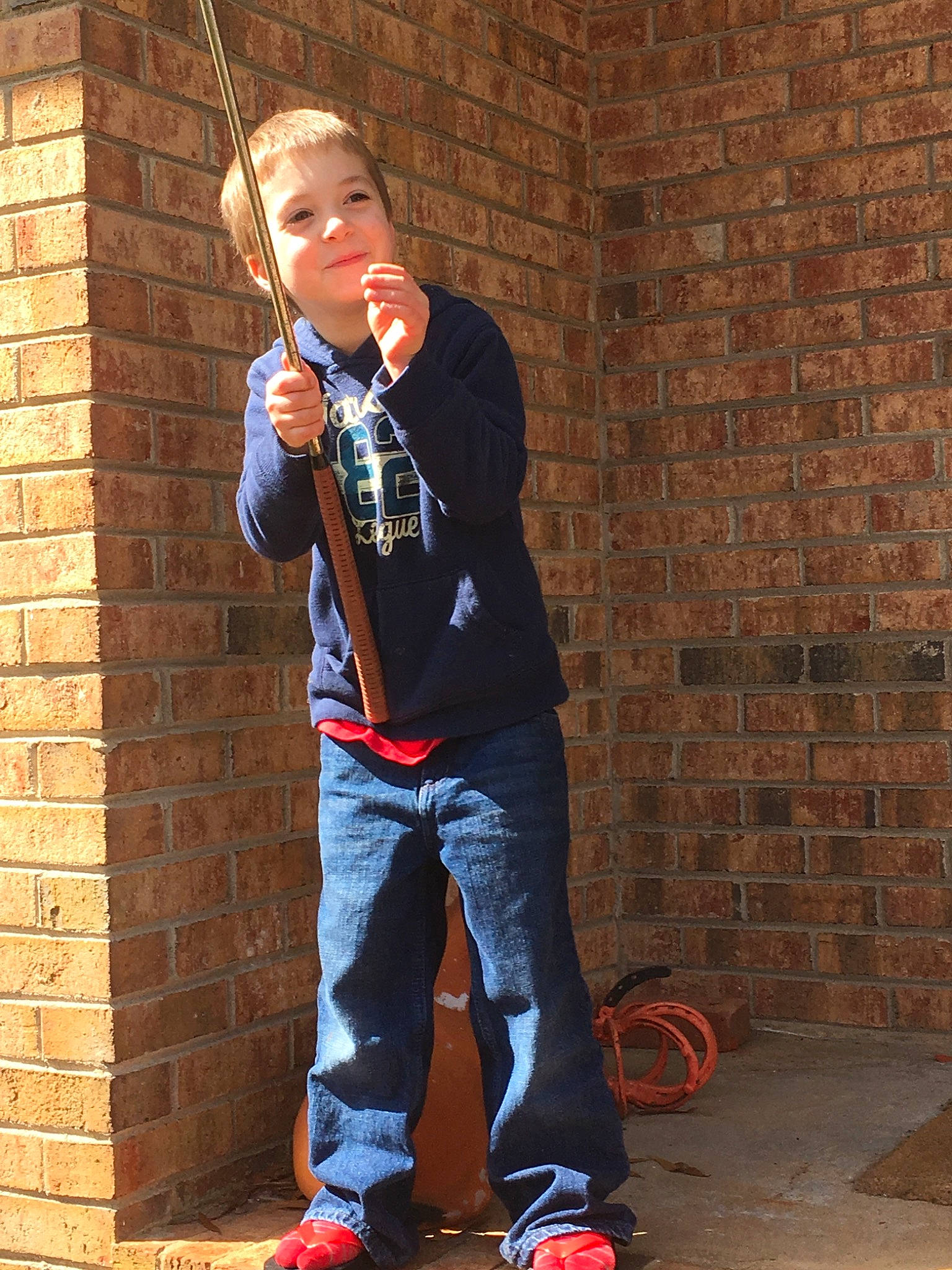 Carter joined the competition — help win amazing prizes! brick, brickwork, child, child_model, denim, footwear, jeans, person, shoe, standing, style, talent_show, trousers, wall