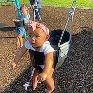 Jyleenia joined the competition — help win amazing prizes! adult, baby, casual, child, clothing, daytime, fun, greenery, headband, outdoor, park, person, plastic_swing, playground, playing, recreation, sunlight, swing, toddler, wood_chips
