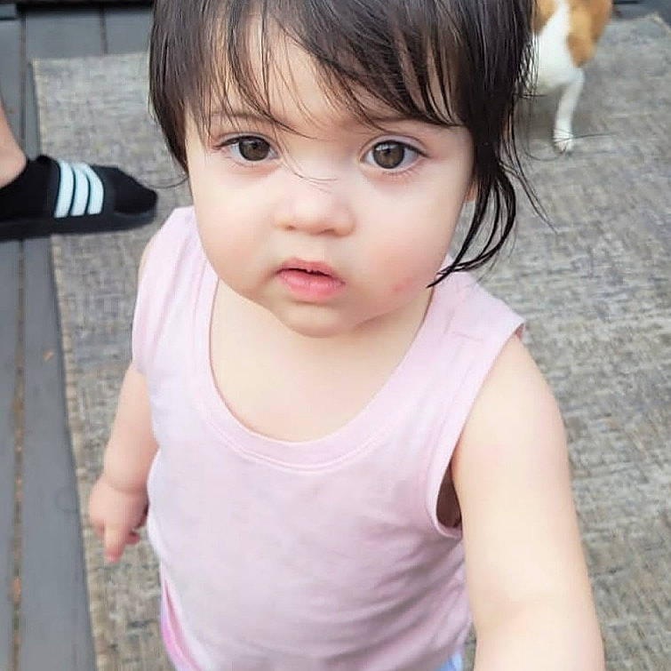 Naiya is registered to the contest to win money with this photo: baby_toddler_clothing, bangs, carnivore, cheek, chest, child, eyelash, felidae, gesture, happy, jaw, lip, mammal, neck, nose, organ, person, skin, sleeve, t_shirt