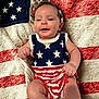 Allyana joined the competition — help win amazing prizes! american_flag, baby, celebration, child, clothing, cute, fabric, happy, headband, infant, lying_down, patriotic, pattern, person, portrait, red_white_blue, smiling, stars, stripes, texture