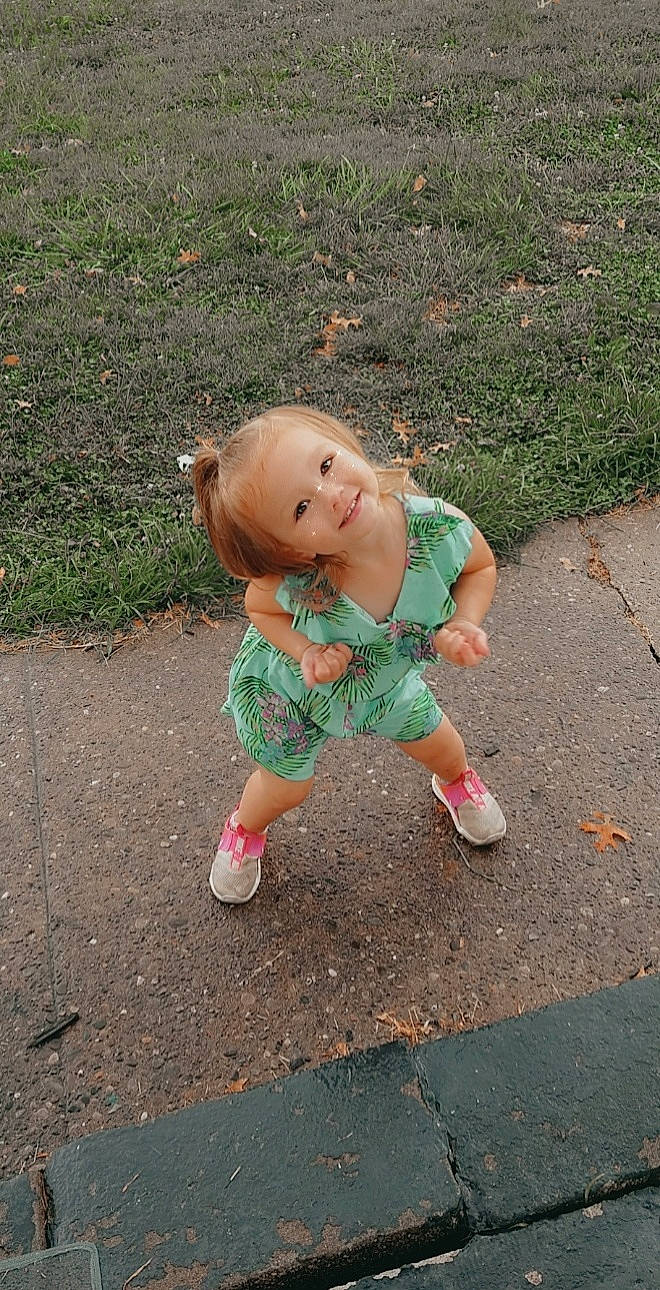 Audriella joined the competition — help win amazing prizes! asphalt, baby, baby_toddler_clothing, eye, face, foot, fun, grass, hair, happy, human_leg, joy, leisure, people_in_nature, person, recreation, road_surface, sitting, soil, thigh